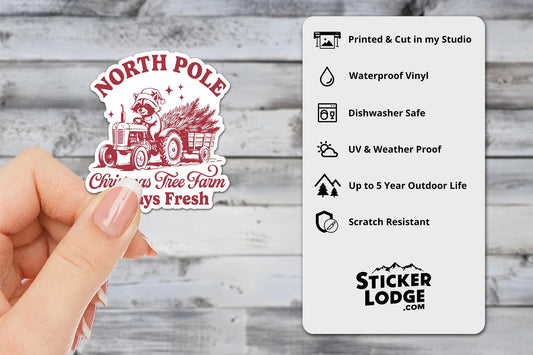 North Pole Christmas Tree Farm Raccoon Vinyl Sticker | Sticker Lodge